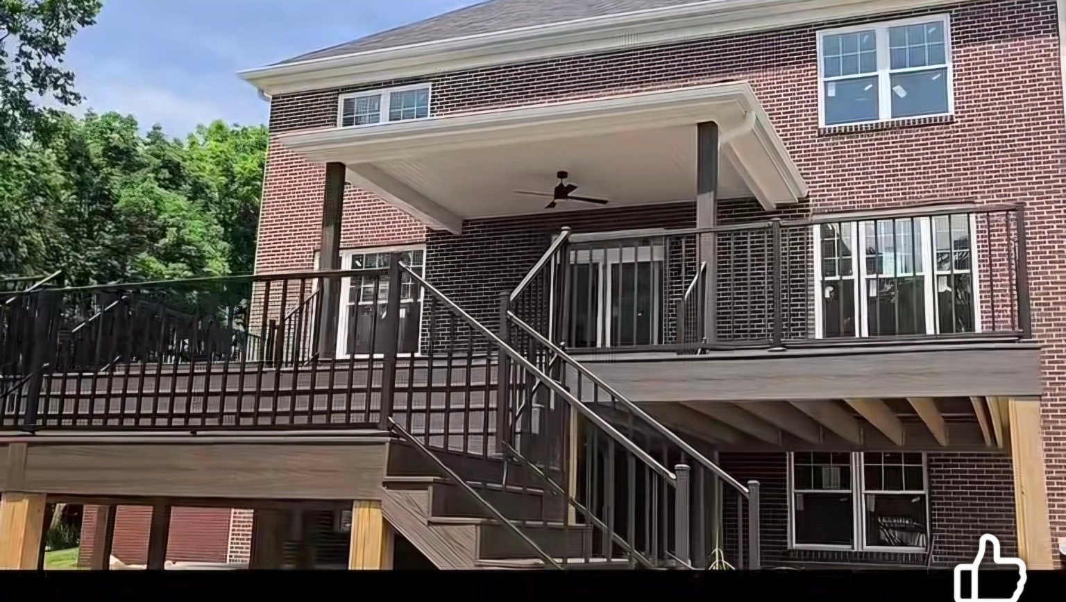 Three-level Trex deck — completed stairs, railing and covered porch detail