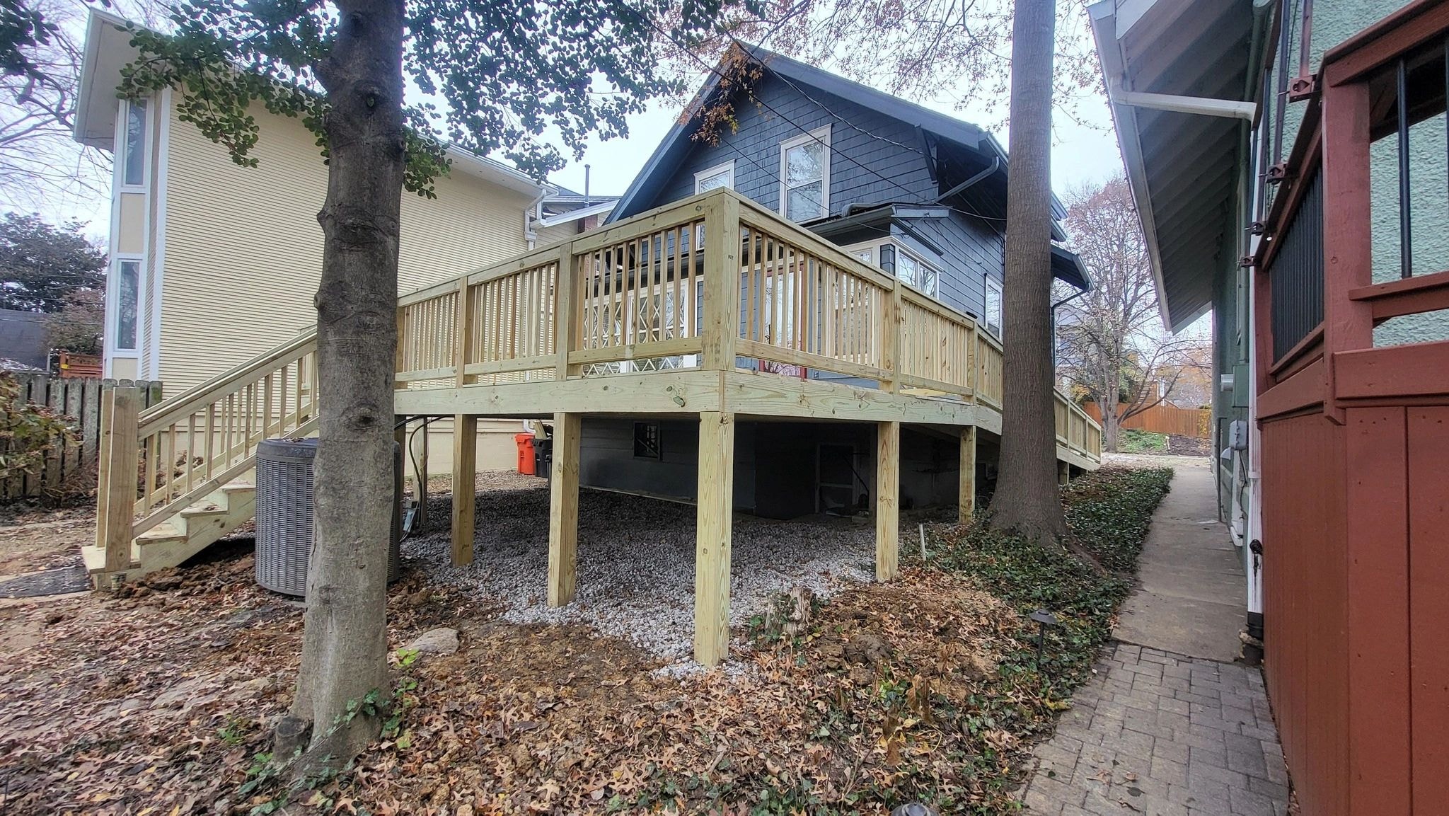 Complete wood deck rebuild — new pressure-treated framing, decking, stairs and railings